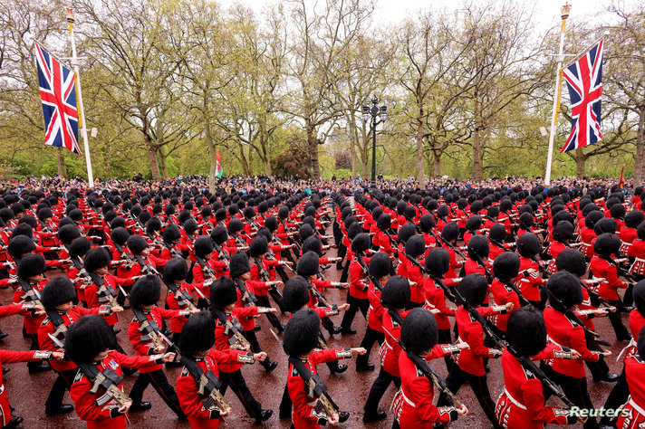 LONDON, ENGLAND - MAY 06: Members of the household division march along The Mall ahead of the golden state coach during the…