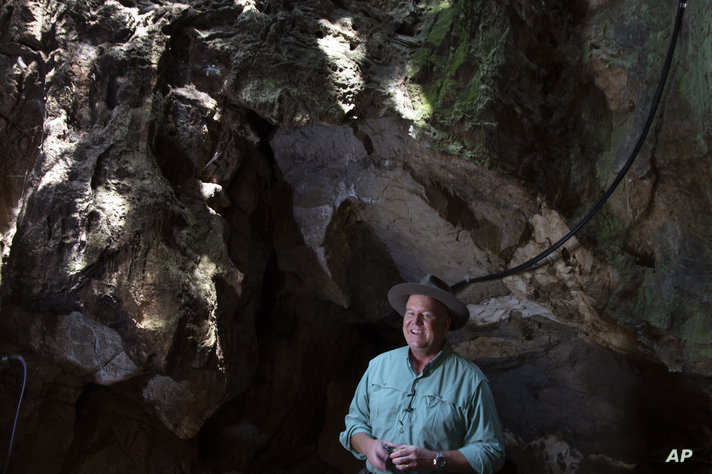 Professor Lee Berger, from the University of the Witwatersrand, talks to the media in the cave where the Homo Naledi fossil was…