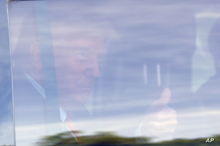 Former President Donald Trump arrives at Trump National Doral resort in Doral, Fla., Monday, June 12, 2023. (AP Photo/Gerald…