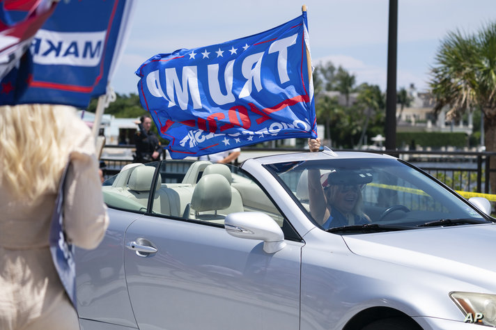 Supporters of former President Donald Trump gather outside Mar-A-Lago, Sunday, June 11, 2023, in Palm Beach, Fla. (AP Photo…