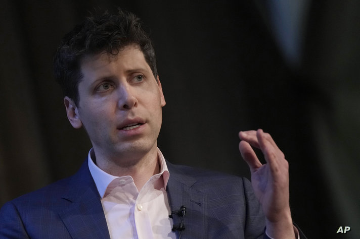 FILE - OpenAI's CEO Sam Altman gestures while speaking at University College London as part of his world tour of speaking…