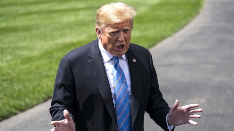 epa07570173 US President Donald J. Trump speaks to the media about China tariffs and the tensions with Iran, as he departs the White House for events in Louisiana, in Washington, DC, USA, 14 May 2019. Electronics imported from China, such as laptops and cellphones, could face tariffs as high as 25 percent should the President authorize another round of tariff hikes. EPA-EFE/JIM LO SCALZO