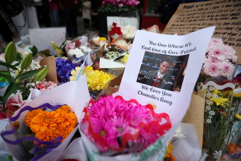 A makeshift memorial for actor Matthew Perry, the wise-cracking co-star of the 1990s hit television sitcom "Friends," who was found dead at his Los Angeles home on October 28, is pictured on Bedford Street in Manhattan in New York City, U.S., October 30, 2023. REUTERS/Mike Segar