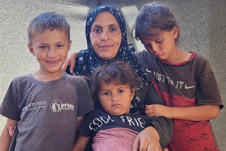 Neama al-Barawi and three of her five children in their makeshift shelter in Rafah. Photograph: Enas Tantesh/for the Guardian