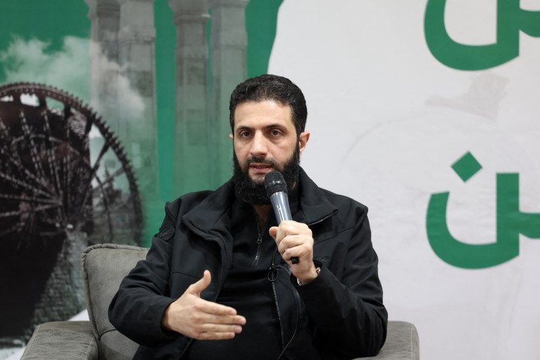الجولاني Abu Mohamed al-Jolani, head of Hayat Tahrir al-Sham (HTS), a jihadist group led by Al-Qaeda's former Syria branch, speaks during a press conference in the area of Bab al Hawa crossing northern Syria late on March 12, 2024. (Photo by OMAR HAJ KADOUR / AFP)