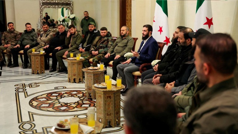 Syria's de facto leader Ahmed al-Sharaa attends a meeting with former rebel faction chiefs, as he reached an agreement with them to dissolve all groups and consolidate them under the Defence Ministry, according to a statement from the new administration, in Damascus, Syria, in this handout image released on December 24, 2024. SANA/Handout via REUTERS ATTENTION EDITORS - THIS IMAGE WAS PROVIDED BY A THIRD PARTY. REUTERS IS UNABLE TO INDEPENDENTLY VERIFY THIS IMAGE.