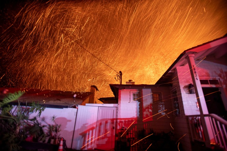 The wind whips embers as the Palisades fire burns during a windstorm on the west side of Los Angeles, California, U.S. January 8, 2025. REUTERS/Ringo Chiu TPX IMAGES OF THE DAY