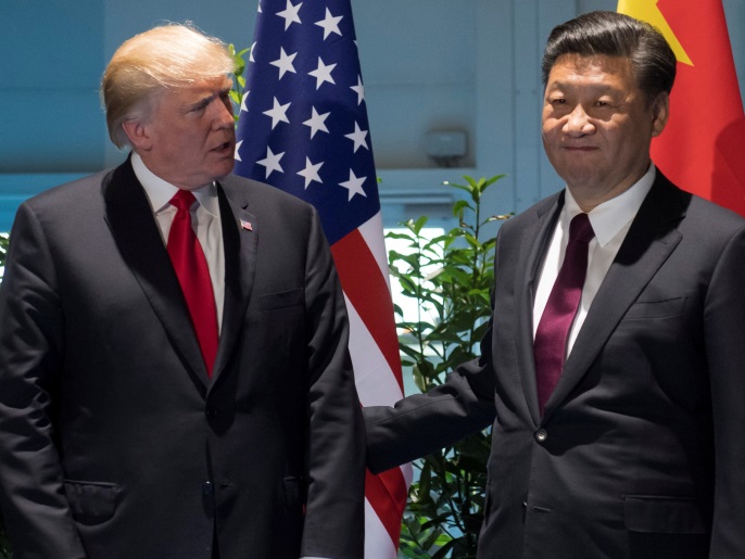 U.S. President Donald Trump and Chinese President Xi Jinping (R) meet on the sidelines of the G20 Summit in Hamburg, Germany, July 8, 2017. REUTERS/Saul Loeb, Pool