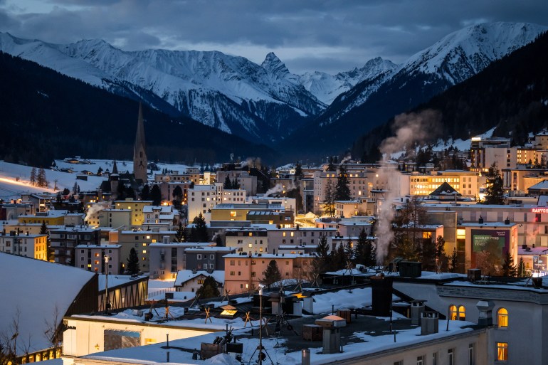 A picture taken on January 20, 2025 shows the Alpine resort of Davos at sunrise during the World Economic Forum (WEF) annual meeting. (Photo by Fabrice COFFRINI / AFP)