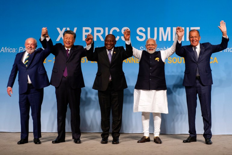 epa10815226 (L-R) Brazil's President Luiz Inacio Lula da Silva, China's President Xi Jinping, South African President Cyril Ramaphosa, Indian Prime Minister Narendra Modi and Russia's Foreign Minister Sergei Lavrov pose for a picture at the BRICS Summit in Johannesburg, South Africa, 23 August 2023. South Africa is hosting the 15th BRICS Summit, (Brazil, Russia, India, China and South Africa), as the group�s economies account for a quarter of global gross domestic product. Dozens of leaders of other countries in Africa, Asia and the Middle East are also attending the summit. EPA-EFE/ALET PRETORIUS / POOL