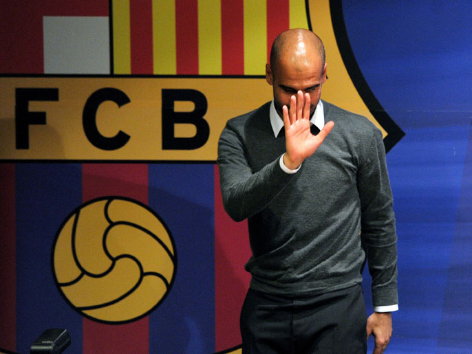 Barcelona's coach Josep Guardiola gestures during a press conference in Barcelona on April 27, 2012. Barcelona coach Pep Guardiola announced today he is leaving the club at the end of the season, ending a four-year reign over one of the greatest eras in club football. TOPSHOTS AFP PHOTO / LLUIS GENE