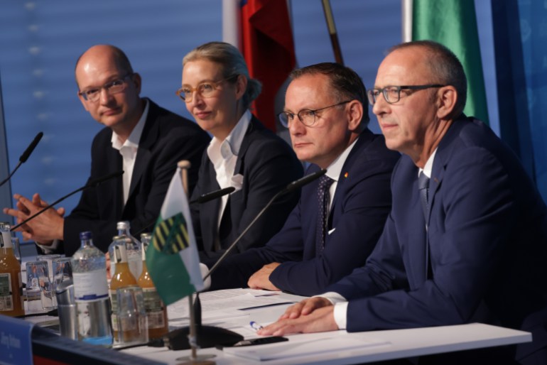 BERLIN, GERMANY - SEPTEMBER 02: (From L to R) Stefan Moeller, co-leader of the far-right Alternative for Germany (AfD) political party in the state of Thuringia, AfD co-leaders Alice Weidel and Tino Chrupalla and AfD Saxony lead candidate Joerg Urban speak to the media the day after state elections in Saxony and Thuringia on September 2, 2024 in Berlin, Germany. The AfD won by a large margin in Thuringia and came in a close second in Saxony, behind the German Christian Democrats (CDU), leaving the parties of the German federal coalition, namely the German Social Democrats (SPD), the Greens and the German Free Democrats (FDP), far behind. The AfD centered its campaigns on issues including the mass deportation of undesirable immigrants, resuming nuclear and coal-fired energy production and a general “Germany First” approach to policy. (Photo by Sean Gallup/Getty Images)