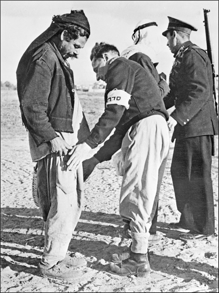 Members of Haganah, the Jewish self-defence force, search 20 January 1948 two Palestininan Arabs at the Tel Aviv gate during clashes between Jewish population of Palestine and Allied Arab forces. The 1948-49 first Israeli-Arab War reflected the opposition fo the Arab states to the formation of the Jewish state in what they considered to be Arab territory. On November 29, 1947, the United Nations' General Assembly voted resolution 181 on the partition of Palestine in two states, one Jewish and one Arab. Jerusalem was to remain under international control. The State of Israel was proclamed on 14 May 1948 by the Jewish National Council and was recognized by the United States and the Soviet Union 15 and 17 May the same year. Arab States of Lebanon, Syria, Jordan, Egypt and Iraq crossed the borders from north, east and south with their regular armies 15 May 1948. Agreements signed in 1949 between Israel and the Arab States ended the 1948 Arab-Israeli War, and established the armistice lines between Israel and the West Bank, also known as the Green Line, until the 1967 Six-Day War. (Photo by AFP)