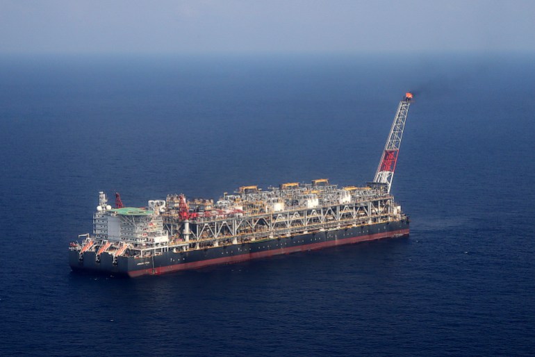 A pilot flame burns on the Agbami floating oil production, storage and offloading vessel (FPSO), operated by Chevron Corp., in the Agbami deepwater oilfield in the Niger Delta, Nigeria, on Wednesday, Dec. 2, 2015. Nigeria plans to review agreements for deep offshore oil production to seek more favorable terms in line with the latest industry standards, state-owned Nigerian National Petroleum Corp. said. Photographer: George Osodi/Bloomberg via Getty Images