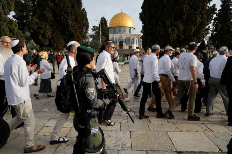 Jewish visitors are seen at the compound that houses Al-Aqsa Mosque, known to Muslims as Noble Sanctuary and to Jews as Temple Mount, while tension arises during clashes in Jerusalem's Old City, April 9, 2023. REUTERS/Ammar Awad