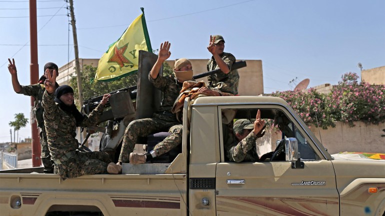 Members of Kurdish People Defence Units (YPG) flash victory sign after coming from Syrian town of al-Raqqa, in Tel Abyad, Syria, 23 June 2015. Kurdish fighters backed by US-led airstrikes captured a strategic town from Islamic State on 23 June as they pushed towards the extremist group's Syrian heartland. The Kurdish People's Protection Units (YPG) and allied rebels took complete control of the town of Ain Issa, bringing them within 50 kilometres of Islamic State's de facto Syrian capital of al-Raqqa, the Syrian Observatory for Human Rights said.