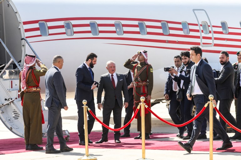 Syria's interim President Ahmed al-Sharaa meets with Jordan's King Abdullah during his visit to Amman, Jordan, February 26, 2025. REUTERS/Alaa Al Sukhni