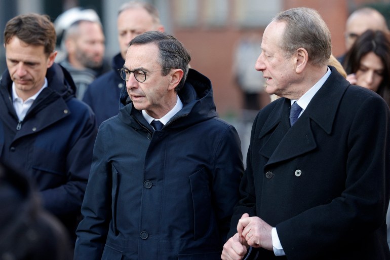 France's Minister of the Interior Bruno Retailleau (C) stands next to the mayor of the 15th district of Paris Philippe Goujon outside the regional professional high school Beaugrenelle in Paris on March 2025, before taking part in a control operation of students' bags. (Photo by GEOFFROY VAN DER HASSELT / AFP)
