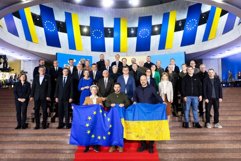 Ukraine's President Volodymyr Zelenskiy (center), Prime Minister Denys Shmyhal (right), and European Commission President Ursula von der Leyen pose for a picture with other officials before the start of a Ukraine-EU summit in Kyiv on February 2.