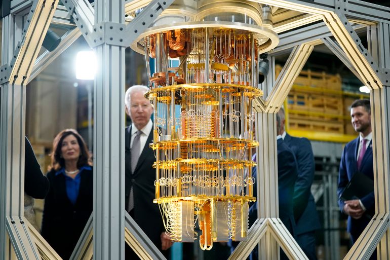 President Joe Biden looks at the IBM System One quantum computer with New York Gov. Kathy Hochul during a tour of an IBM facility in Poughkeepsie, N.Y., on Thursday Oct. 6, 2022. (AP Photo/Andrew Harnik)