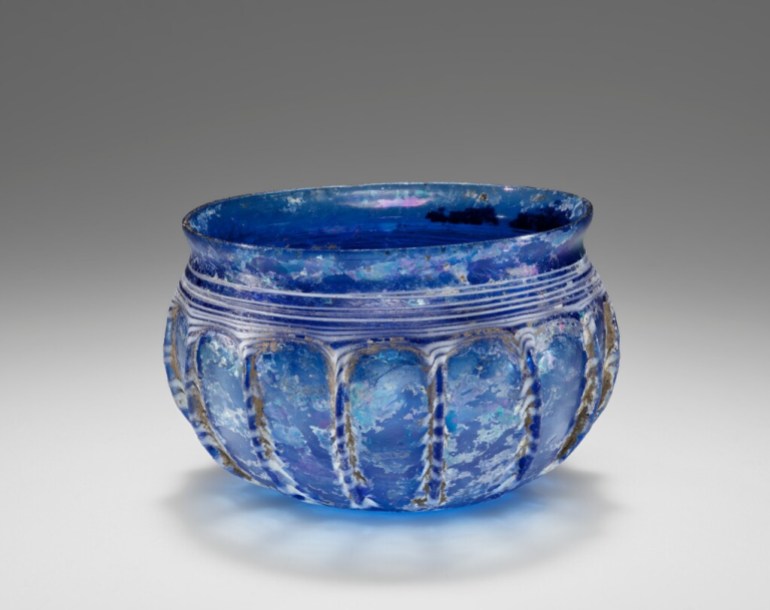 Blue Ribbed Bowl (Rippenschale) with White Trailssecond half of 1st century B.C. Unknown artist/maker On view at Getty Villa, Gallery 214, Greek and Roman Glass View full record details Roman cast blue rippenschale drinking bowl with ribbed decoration around the body. Traces of white glass trails are visible across the ribs and once decorated the areas in between the ribs, as indicated by faint areas of iridescence. Bands of white glass decorate the area just below the slightly flared lip. The bottom of the vessel has a spiraling trail of white glass.