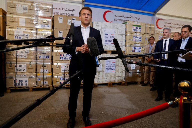 France's President Emmanuel Macron delivers a speech in front of humanitarian aid destined to Gaza, at the Egyptian Red Crescent warehouse in Egypt's northeastern city of Arish in the north of the Sinai peninsula, about 55 kilometres west of the border with the Gaza Strip, on April 8, 2025.