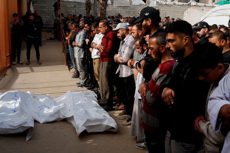 Mourners pray next to the bodies of Palestinians killed in Israeli strikes, at Nasser hospital, in Khan Younis, in the southern Gaza Strip, April 7, 2025. REUTERS/Hatem Khaled