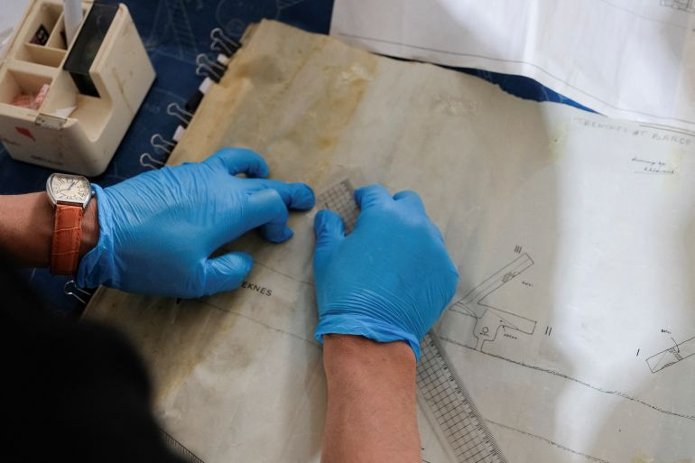 An employee of the Antiquities Inspection Department restores old, neglected maps of the archaeological sites in Benghazi, Libya March 25, 2025. REUTERS/Esam Omran Al-Fetori