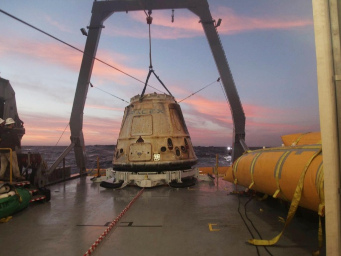 This Tuesday, Feb. 10, 2015 photo made available by SpaceX shows their Dragon capsule aboard a ship in the Pacific Ocean west of Mexico's Baja Peninsula after returning from the International Space Station, carrying about 3,700 lbs of cargo for NASA. (AP Photo/SpaceX)