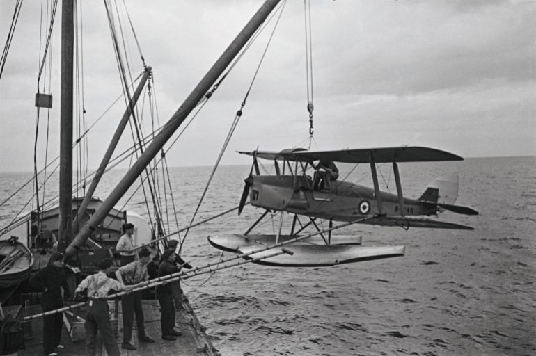 De Havilland DH82B Queen Bee Preparations being made for the seaborne retrieval of a Fleet Air Arm De Havilland DH82B Queen Bee seaplane drone ( N- 1846) which is flown by wireless control without a pilot and is devised as a low-cost radio-controlled target aircraft for anti-aircraft gunnery training at the Weybourne Anti-Aircraft Artillery Range on 7th July 1939 near Weybourne, United Kingdom. (Photo by Fox Photos/Hulton Archive/Getty Images)