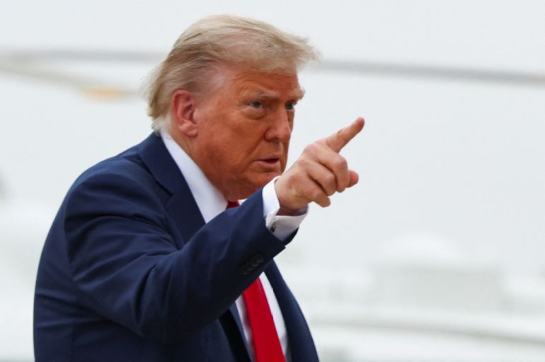 U.S. President Donald Trump points a finger as he departs for Canada to attend the G7 Leaders' Summit, from Joint Base Andrews in Maryland, U.S., June 15, 2025. REUTERS/Kevin Lamarque