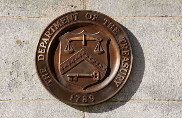 FILE PHOTO: A bronze seal for the Department of the Treasury is shown at the U.S. Treasury building in Washington, U.S., January 20, 2023. REUTERS/Kevin Lamarque/File Photo