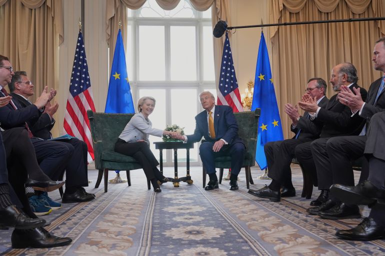 President Donald Trump and European Commission President Ursula von der Leyen shake hands after reaching a trade deal at the Trump Turnberry golf course in Turnberry, Scotland Sunday, July 27, 2025. (AP Photo/Jacquelyn Martin)