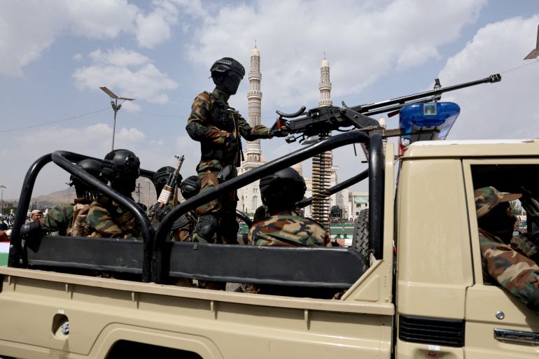 Houthi police officers patrol on a vehicle the site of a rally held by protesters, predominantly Houthi supporters, in solidarity with Palestinians and Iran, amid the Iran-Israel conflict, in Sanaa, Yemen June 20, 2025. REUTERS/Khaled Abdullah TPX IMAGES OF THE DAY
