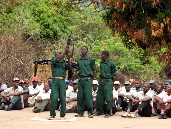 SDS3574 - GORONGOSA, -, MOZAMBIQUE : (FILES) This file picture taken on November 8, 2012 in the Gorongosa's mountains shows fighters of former Mozambican rebel movement "Renamo" receiving military training. Mozambique's government said it was still open to talks with former civil war rebels on June 20, 2013 despite their vow to launch a campaign to sabotage key infrastructure. "The government reiterates its availability to meet with Renamo on 24 June," the cabinet said in statement without referring to Renamo's threats. AFP PHOTO / JINTY JACKSON
