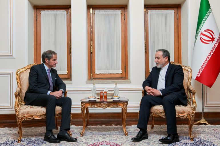 In this photo released by the Iranian Foreign Ministry, Foreign Minister Abbas Araghchi, right, speaks with International Atomic Energy Agency (IAEA) Director General Rafael Mariano Grossi during their meeting in Tehran, Iran, Wednesday, April 16, 2025. (Iranian Foreign Ministry via AP)