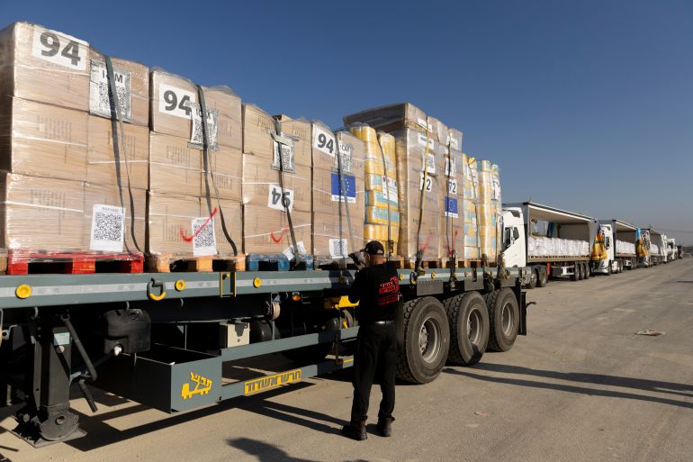 EREZ WEST CROSSING, ISRAEL - NOVEMBER 11: A driver prepares a truck carrying humanitarian aid before crossing into the Gaza Strip on November 11, 2024 in Erez West Crossing, Israel. Last month, the UN's Acting Under-Secretary-General for Humanitarian Affairs and Emergency Relief, Joyce Msuya, said that Israel had blocked food aid from entering northern Gaza between October 2-15. According to the UN, more than 1.8 million Palestinians in Gaza are experiencing "extremely critical" levels of hunger. (Photo by Amir Levy/Getty Images)