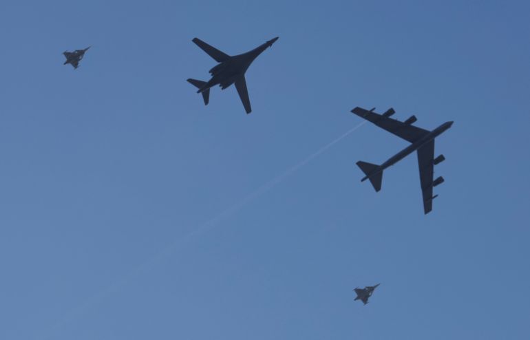 A B-1B Lancer and a B-52 Stratofortress, escorted by Swedish Jas 39 Gripen, pass over Stockholm, Sweden, as the Swedish Armed Forces conduct a joint exercise with the U.S. Bomber Task Force, March 6, 2024. REUTERS/Leonhard Foeger