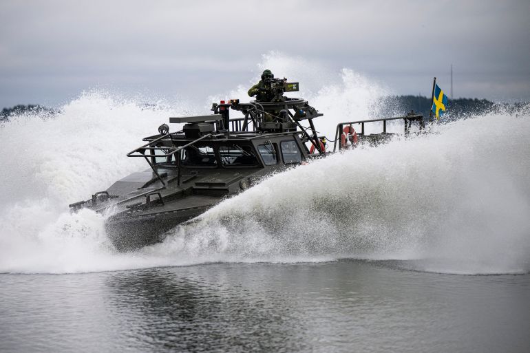 A CB90, a class fast assault craft, is pictured during a military demonstration following a press conference with Swedish Prime Minister Ulf Kristersson as a new support package for Ukraine is presented on February 20, 2024, at the Berga Naval Base, part of the Swedish Armed Forces, located south of Stockholm. Sweden said on February 20 it would give 7.1 billion kronor (USD 682 million) worth of military equipment to Ukraine, in a boost for the country as it struggles to fight off Russia's invasion. The package will consist of artillery shells, air defence, boats and underwater weapons such as mines and torpedoes as well as training for Ukrainian soldiers. (Photo by Jonathan NACKSTRAND / AFP)