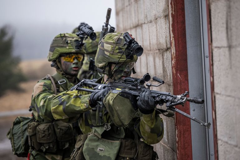 Soldiers from the 13th counter intelligence battalion, 2nd reconnaissance platoon of the Swedish Armed Forces, participate in military exercise in Kungsangen, near Stockholm on February 27, 2024. (Photo by Jonathan NACKSTRAND / AFP)