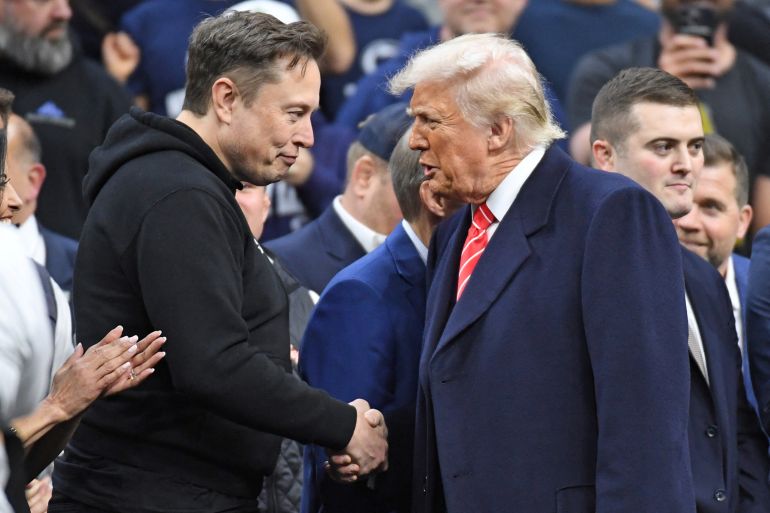 FILE PHOTO: Mar 22, 2025; Philadelphia, PA, USA; Elon Musk and President Donald Trump during the Division I Men's Wrestling Championship held at Wells Fargo Center. Mandatory Credit: Eric Hartline-Imagn Images/File Photo