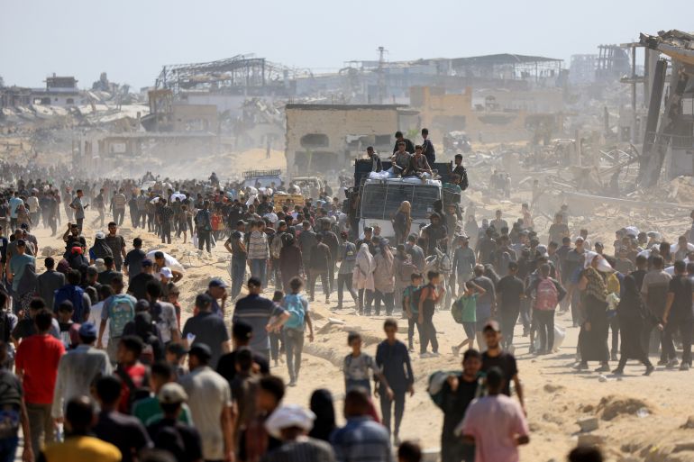Palestinians gather as they seek aid supplies that entered Gaza through Israel, amid a hunger crisis, in Beit Lahia in the northern Gaza Strip July 20, 2025. REUTERS/Dawoud Abu Alkas