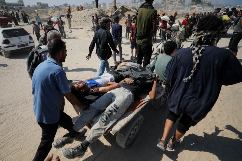 Palestinians, who were wounded in an Israeli fire while seeking aid supplies, according to medics, are transported after aid entered Gaza through Israel, amid a hunger crisis, in Beit Lahia, in the northern Gaza Strip July 20, 2025. REUTERS/Dawoud Abu Alkas