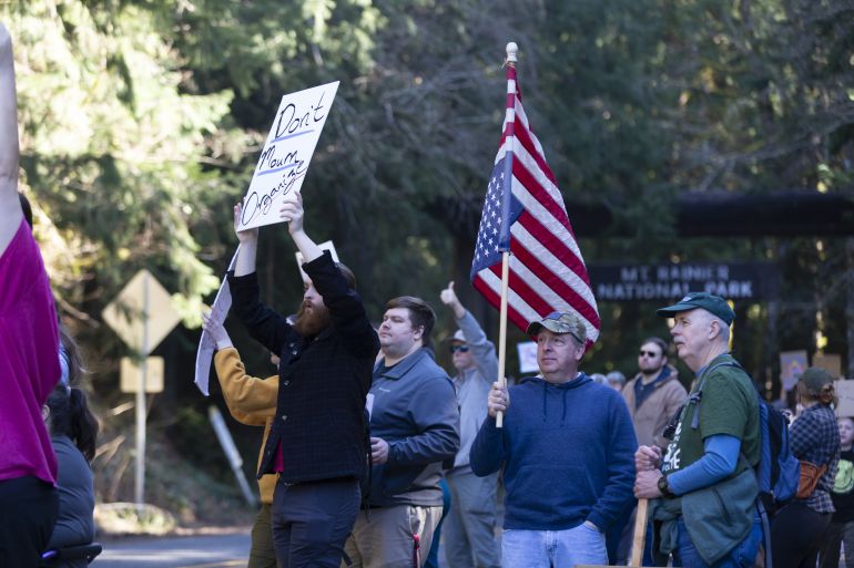 Protesters gather at Washington's Mount Rainier National Park in a rally to save public lands and in support of employees of federal land management agencies on Saturday, March 1, 2025. A group calling themselves the Resistance Rangers organized the nationwide "Protect Your Parks Protest" across all national park sites in one day.