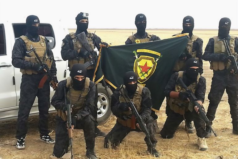 YAT fighters with the unit's flag in late 2015. Wikipedia