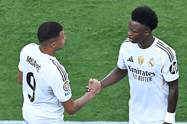 Real Madrid's French forward #09 Kylian Mbappe greets Real Madrid's Brazilian forward #07 Vinicius Junior during the FIFA Club World Cup 2025 quarterfinal football match between Spain's Real Madrid and Germany's Borussia Dortmund at the MetLife stadium in East Rutherford, New Jersey on July 5, 2025. (Photo by ANGELA WEISS / AFP) (Photo by ANGELA WEISS/AFP via Getty Images)
