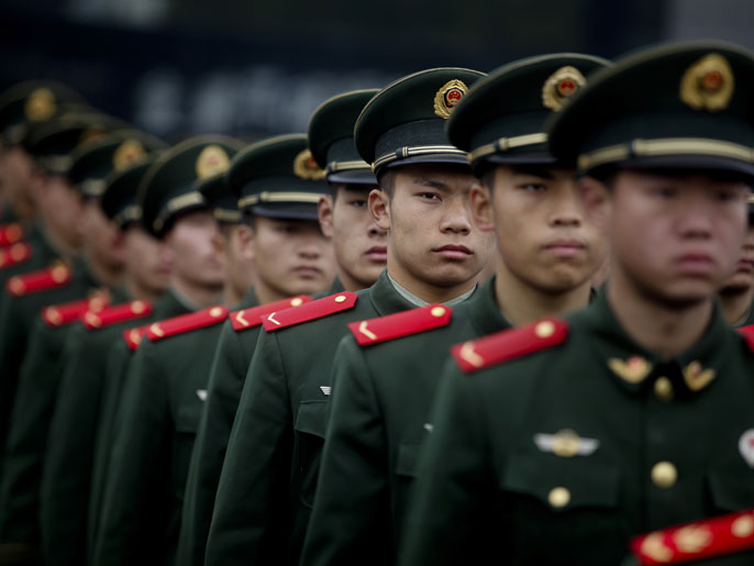 epa03506628 Members of China's PLA (Peoples Liberation Army) attend a ceremony to observe the 75th anniversary of the Nanjing Massacre, at the Memorial Hall of Victims of the Nanjing Massacre by Japanese Invaders in Nanjing, China, 13 December 2012. On 13 December 1937 the Japanese army took Nanjing, then known as the capital of Nationalist China 'Nanking', and in the following seven weeks murdered between 260,000 and 350,000 Chinese people (depending on estimates). The most conservative figure is still more than the combined death toll of the atomic blasts at Hiroshima and Nagasaki - making the Nanjing Massacre one of the greatest atrocities of the 20th century, if not ever. EPA/DIEGO AZUBEL