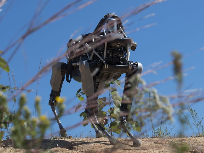 A handout picture made available by the US Marines on 19 September 2015 shows 'Spot', a quadruped prototype robot, walking down a hill during a demonstration at the Marine Corps Base Quantico, Virginia, USA, 16 September 2015. Employees of the Defense Advanced Research Projects Agency trained Marines from the Marine Corps Warfighting Lab how to operate 'Spot'. Spot is a 160-pound, electrically powered, hydraulically-actuated robot designed by Boston Dynamics. While Spot is not intended to be used operational, the Marine Corps Warfighting Lab is evaluating the uses of other robotics in the future. EPA/Defense Media Activity / Cpl. Eric Keenan