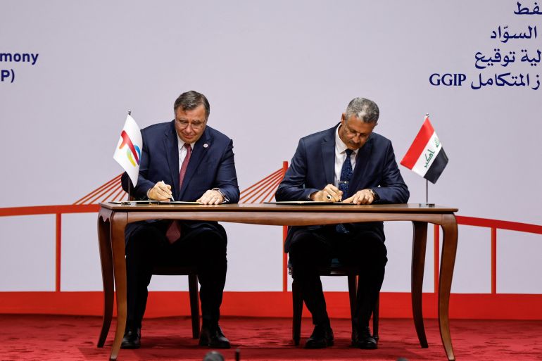 Iraqi Deputy Prime Minister for Energy Affairs and Minister of Oil, Hayan Abdul Ghani Al-Swad and Patrick Pouyanne, Chairman and CEO of TotalEnergies, attend a signing ceremony of the Gas Growth Integrated Project (GGIP) in Baghdad, Iraq, July 10, 2023. REUTERS/Thaier Al-Sudani