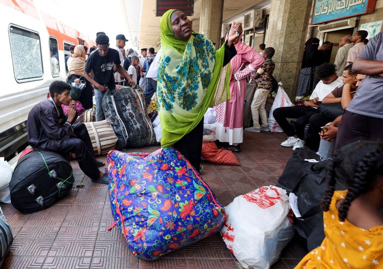 People gather at a train station, as Sudanese families displaced by conflict between the Sudanese Armed Forces and the Rapid Support Forces (RSF) crowd at Cairo’s main station to board a free train with a voluntary return coordinated by the Egyptian government to Aswan, where buses will take them back to their homes in Khartoum, in Cairo, Egypt July 28, 2025. REUTERS/Amr Abdallah Dalsh